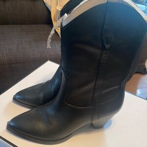 Women western style midi boots , leather upper and manmade bottom .